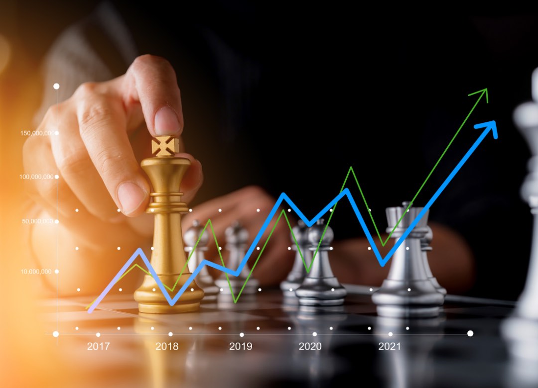A hand moving a gold chess king forward, overlaid with a rising performance chart